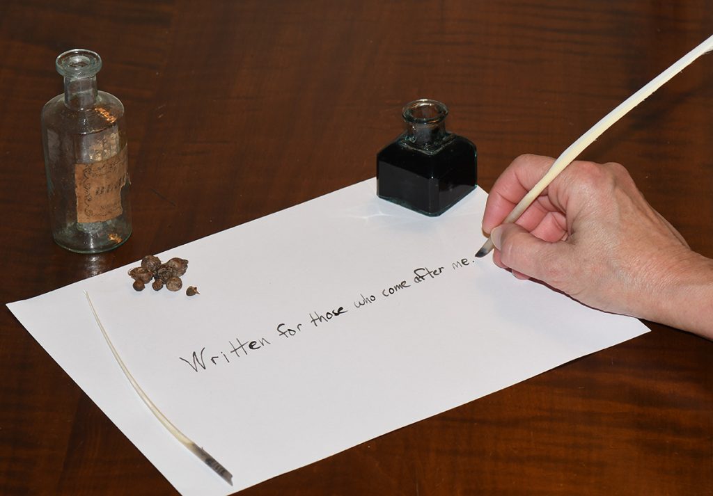 writing with a quill pen and wasp gall ink
