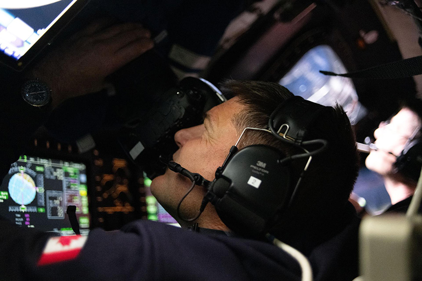 Jeremy Hansen photographing from Orion spacecraft
