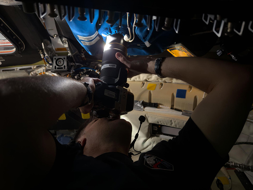 Jeremy Hansen photographing from Orion spacecraft